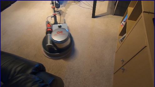 Cleaning living room carpet with a heated bonnet cleaning machine